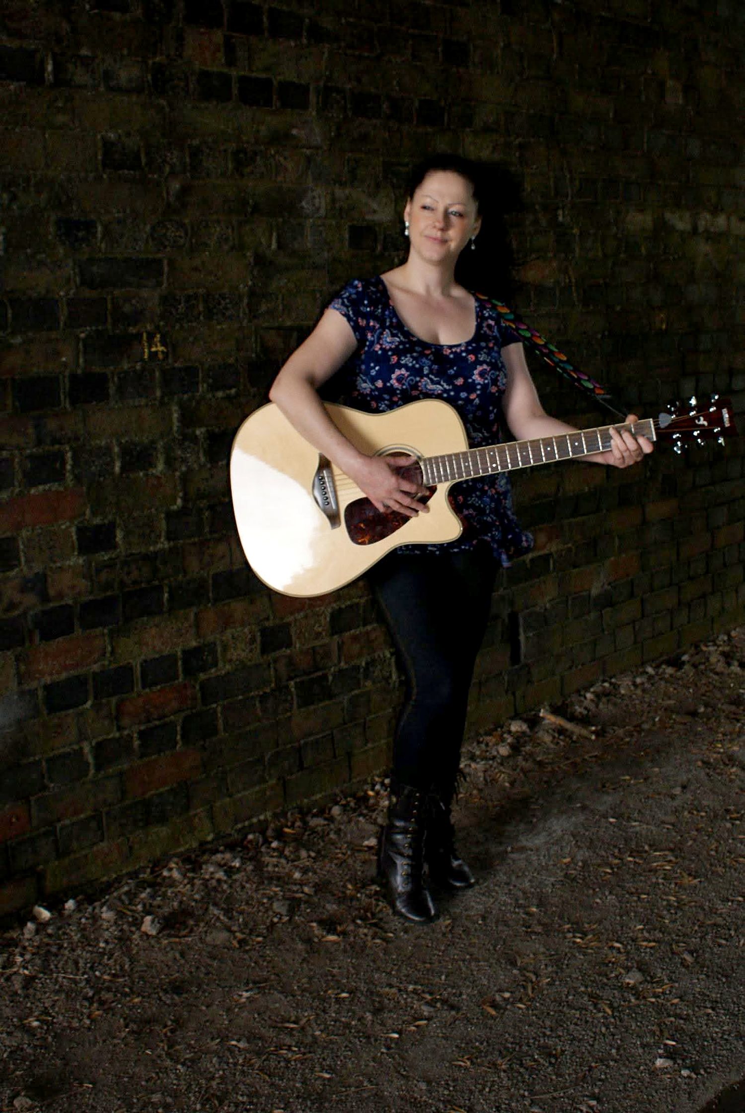 Bobbyjo performing with her acoustic guitar